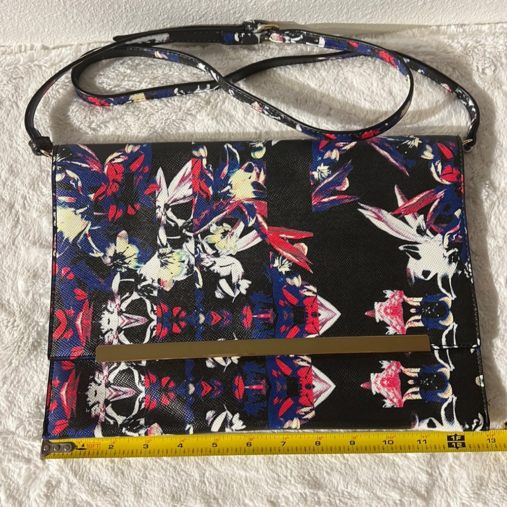 Oversized clutch handbag with strap. Never worn new w/I tags.